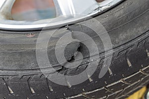 Close-up of a damaged flat car tire photo