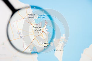 Dammam city visualization illustrative concept on display screen through magnifying glass photo