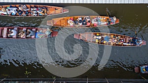 Damnoen Saduak floating market, Farmer go to sell organic products, fruits, vegetables and Thai cuisine, Tourists visiting by boat