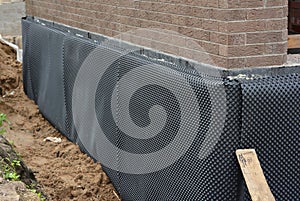 Damp proofing. House basement,foundation insulation details with waterproofing and Damp Proof membranes outdoors photo