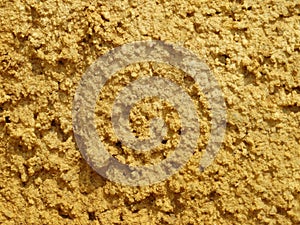 Damp sand with yellow-orange colour