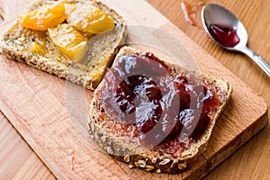 Damson Plum Jam on bread with Apricot jam.