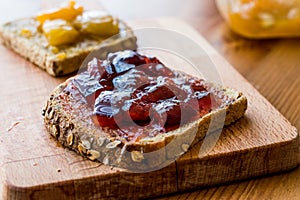 Damson Plum Jam on bread with Apricot jam.