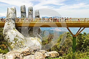 Danang, Vietnam - JUNE, 24, 2019: The Golden Bridge in the Bana Valley, supported by a giant hand This bridge is 1,400 meters