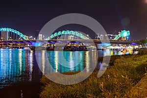 Dragon bridge cross Han river at Danang city in Vietnam