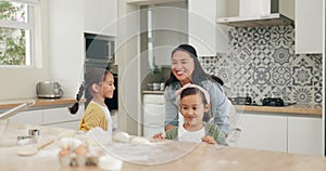 Dance, baking and a mother with her kids in the kitchen of their home together for cooking fun. Family, love and sister