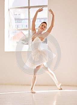 Dance, ballet and studio with a woman dancer training, practicing or dancing for a performance, recital or rehearsal