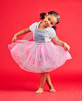 Dance, child and curtsy in princess dress, fantasy and red background on studio mockup. Happy kids holding ballerina