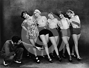 Dance instructor instructing five young women