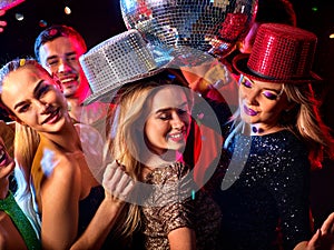 Dance party with group people dancing and disco ball.