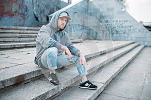 Dance performer sitting on the steps, urban style