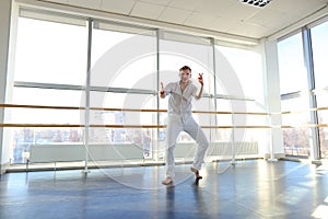 Dance school graduate making body movements.