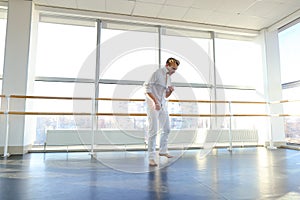 Dance school graduate making body movements.