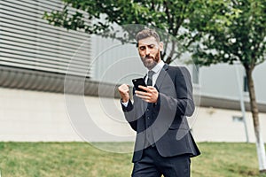 Dance success. Successful confident businessman celebrates his success. Young man formal wear his hands up and rejoice