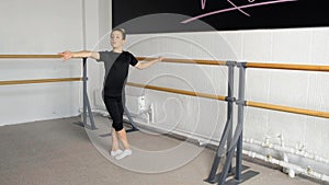 Dance training at a ballet school, for children, boys and girls. Fourth position