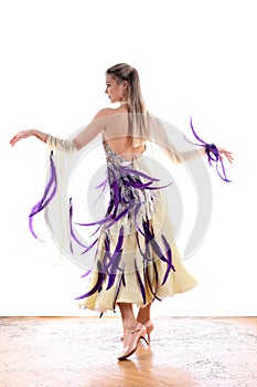 Dancer in ballroom against white background