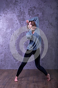 Dancer girl with short brown curly hair.