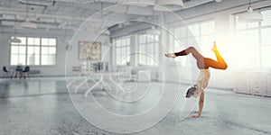 Dancer guy doing onehand stand. Mixed media photo