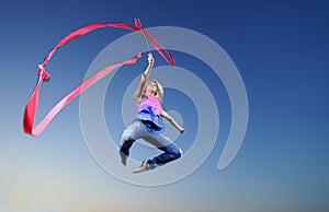 Dancer jumping with ribbon