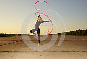Dancer jumping with ribbon