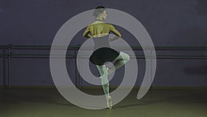 The dancer performs a pirouette