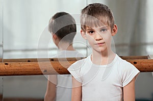 Dancer standing near barre