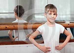 Dancer standing near barre