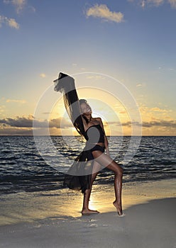 Dancer standing at the ocean edge