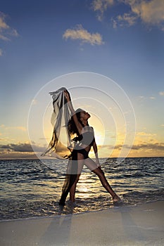 Dancer standing at the ocean edge