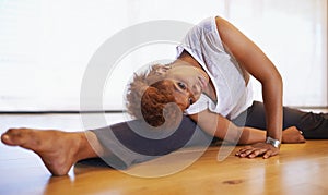 Dancer, stretching and person on floor in studio or academy preparing for practice and start rehearsal in exercise