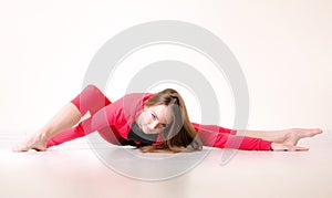 Dancer woman sit on half twine