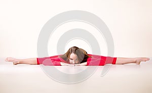 Dancer woman sit on half twine