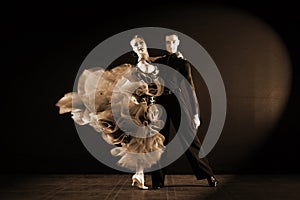 Dancers in ballroom isolated on black background