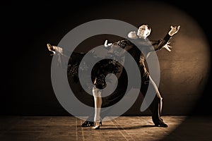 Dancers in ballroom isolated on black background