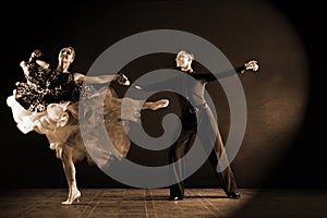 Dancers in ballroom isolated on black background