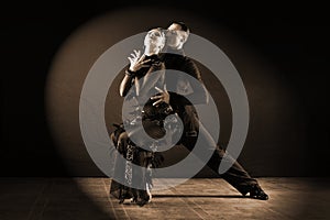 Dancers in ballroom isolated on black background