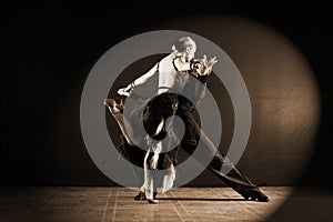 Dancers in ballroom isolated on black background