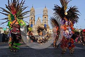 The dancers are dancing in front of the Basilica of Zapopan.