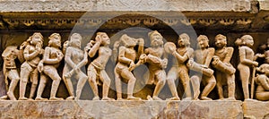 Dancers and musicians in erotic scenes, Kahjuraho temple, India