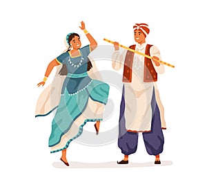 Dancers performing Indian folk dance, Dandiya Raas. Man and woman dancing in traditional costumes of India. Couple in