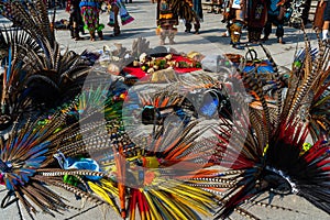 The dancers are resting and left their plumes and musical instruments on the floor of the cathedral atrium.