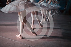 Dancers in white tutu synchronized dancing