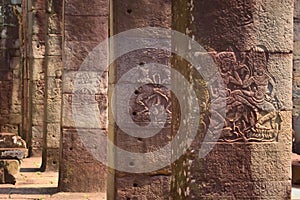 Dancing apsaras in bas-relief on the sandstone columns of Banteay Kdei temple, in Angkor Wat complex near Siem Reap, Cambodia.