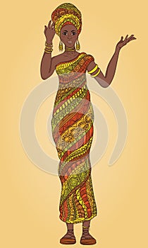 Dancing beautiful African woman in turban and traditional costume with ethnic geometric ornament full length.