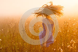 Dancing beautiful girl in fog