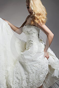 Dancing bride woman in wedding dress