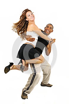 Dancing couple with latino instructor