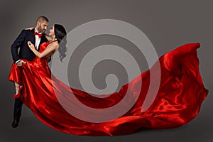 Dancing Couple, Woman in Red Dress and Man in Suit, Waving Fabric photo