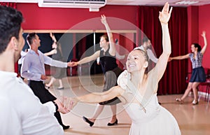 Dancing couples enjoying latin dances