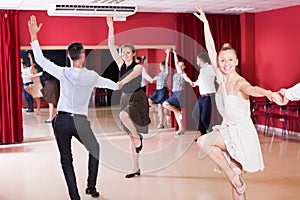 Dancing couples enjoying latin dances